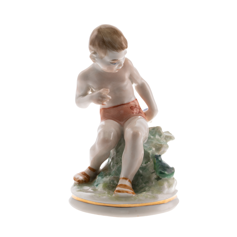 Figure A boy with a frog